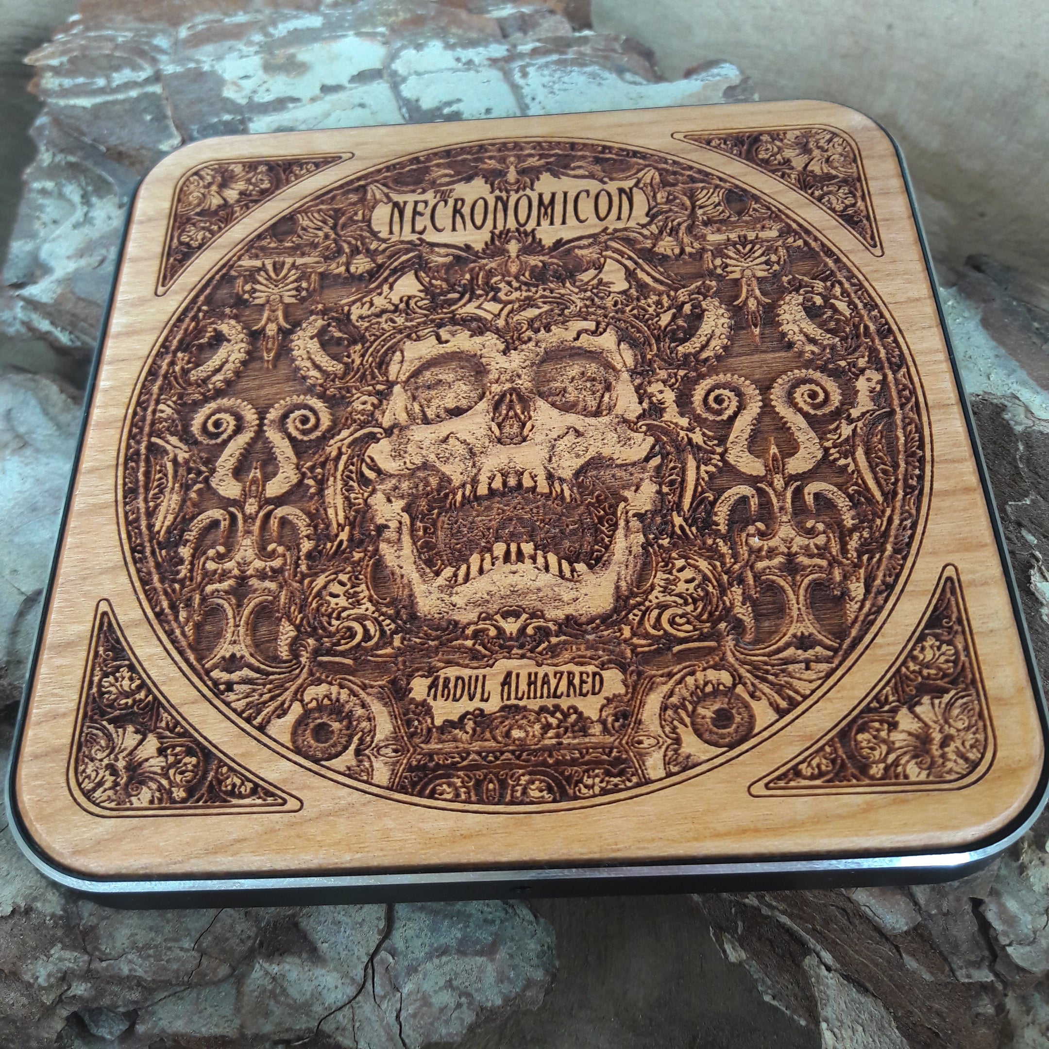 Artisan wooden charger with hand-painted book of the dead art.