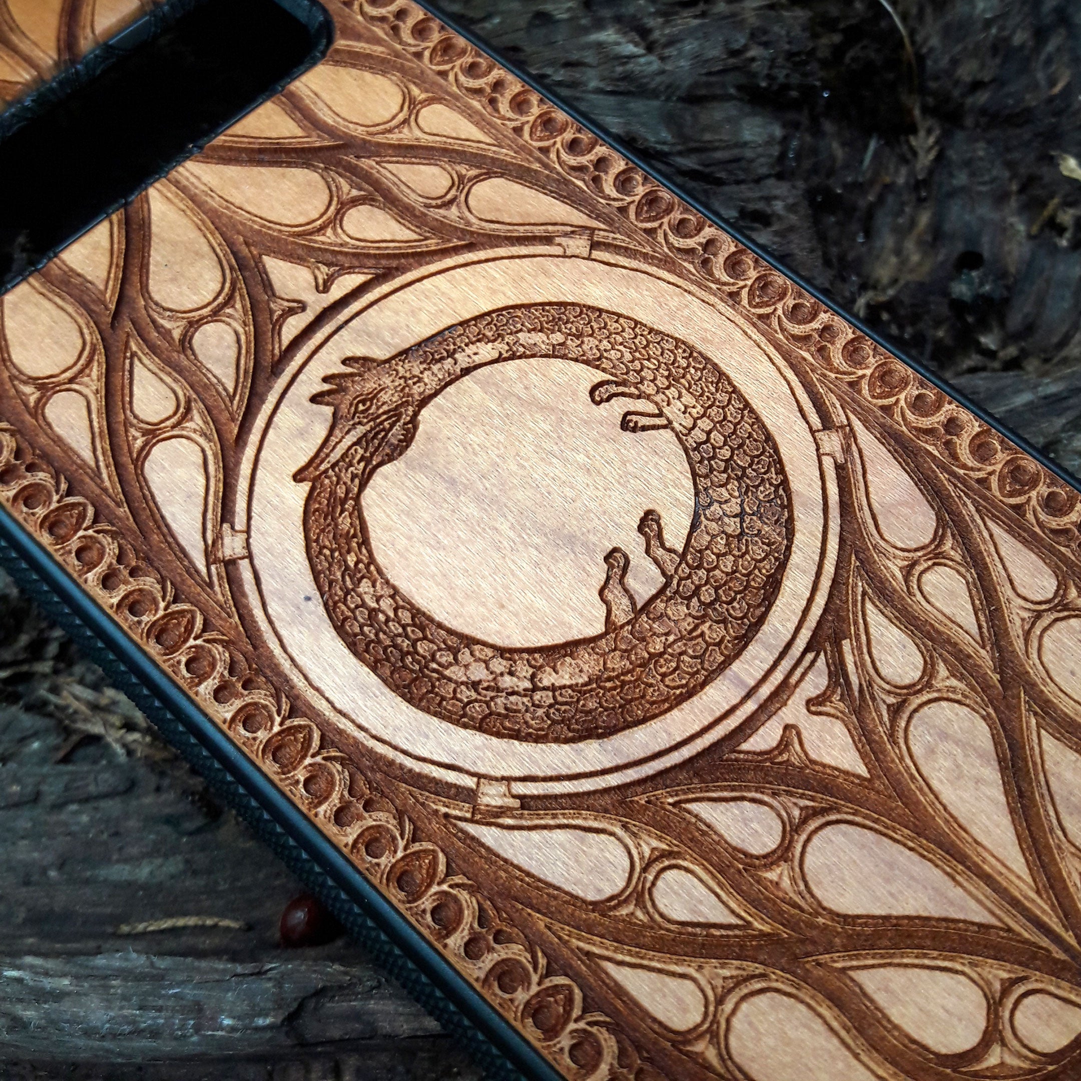 Ouroboros symbol engraved