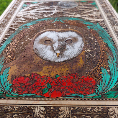 Laser-etched night owl art on wood panel, handcrafted wall decor.