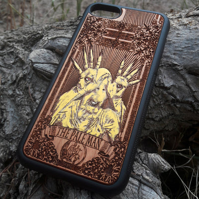 Laser-engraved Pale Man design from Pan's Labyrinth on a wooden phone case, compatible with iPhone 16, Galaxy S25, and more.