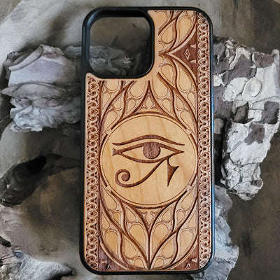 Wooden phone case featuring the Eye of Ra design, laser-engraved for iPhone & Samsung Galaxy. Compatible with iPhone 15, 14, 13, 12, 11 Pro Max Mini, Samsung Galaxy S24, S23, S22, S21, S20 Ultra Plus, and Note 20. Unique, durable, and slim.