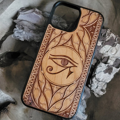 Wooden phone case featuring the Eye of Ra design, laser-engraved for iPhone & Samsung Galaxy. Compatible with iPhone 15, 14, 13, 12, 11 Pro Max Mini, Samsung Galaxy S24, S23, S22, S21, S20 Ultra Plus, and Note 20. Unique, durable, and slim.