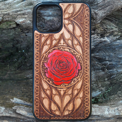Laser-engraved red rose design on a wooden phone case, featuring intricate floral artwork, compatible with iPhone 16, iPhone 15, Galaxy S25, and more.