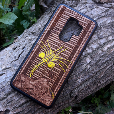 Laser-engraved wooden phone case for Samsung Galaxy and iphone, featuring intricate gothic artwork.