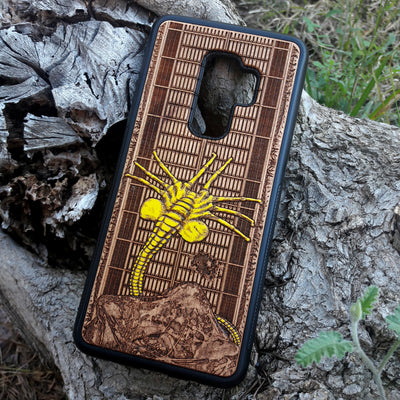 Laser-engraved wooden phone case for Samsung Galaxy and iphone, featuring intricate gothic artwork.