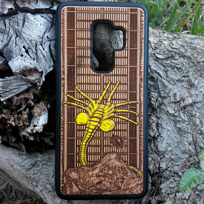 Laser-engraved wooden phone case for Samsung Galaxy and iphone, featuring intricate gothic artwork.