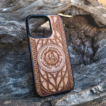 Lord of the Rings wood phone case featuring the Eye of Sauron surrounded by Elvish script and intricate, elegant patterns. Laser-engraved for durability and unique artistry, this case is compatible with iPhone 16, 15, 14, 13, 12, 11, Pro Max, Mini, and Samsung Galaxy S25, S24, S23, S22, S21, S20 Ultra, Plus, Note 20. A stunning and protective accessory for Tolkien fans.