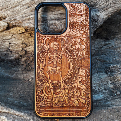 Detailed vintage gothic wooden phone case with skeleton design for iPhone  and Samsung Galaxy S. Handcrafted with intricate engraving, offering a sleek and artistic touch.