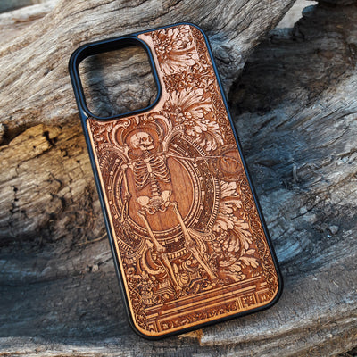 Detailed vintage gothic wooden phone case with skeleton design for iPhone  and Samsung Galaxy S. Handcrafted with intricate engraving, offering a sleek and artistic touch.