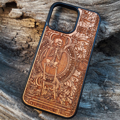 Detailed vintage gothic wooden phone case with skeleton design for iPhone  and Samsung Galaxy S. Handcrafted with intricate engraving, offering a sleek and artistic touch.