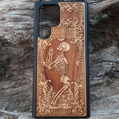 Shop our premium wooden phone cases designed for iPhone , iPhone 15, Galaxy S23, S22, Note 20, and more. Featuring intricate designs like the praying skeleton, it’s the perfect personalized gift for tech enthusiasts. Available for multiple iPhone and Galaxy models, these cases offer durable protection with style.