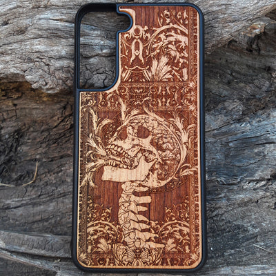 Wooden phone case with a detailed carved skull design from Scream, available for iPhone , iPhone 15, Galaxy S, Galaxy S24, and more. Perfect for fans of horror and gothic art, offering durability and unique style.