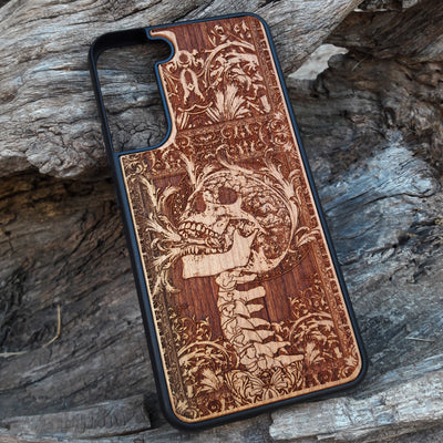 Wooden phone case with a detailed carved skull design from Scream, available for iPhone , iPhone 15, Galaxy S, Galaxy S24, and more. Perfect for fans of horror and gothic art, offering durability and unique style.