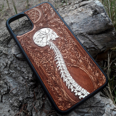 Laser-engraved skeleton spine design on a wooden phone case, compatible with iPhone and samsung galaxy