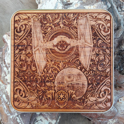 Wooden wireless charger engraved with Star Wars-style spaceships.