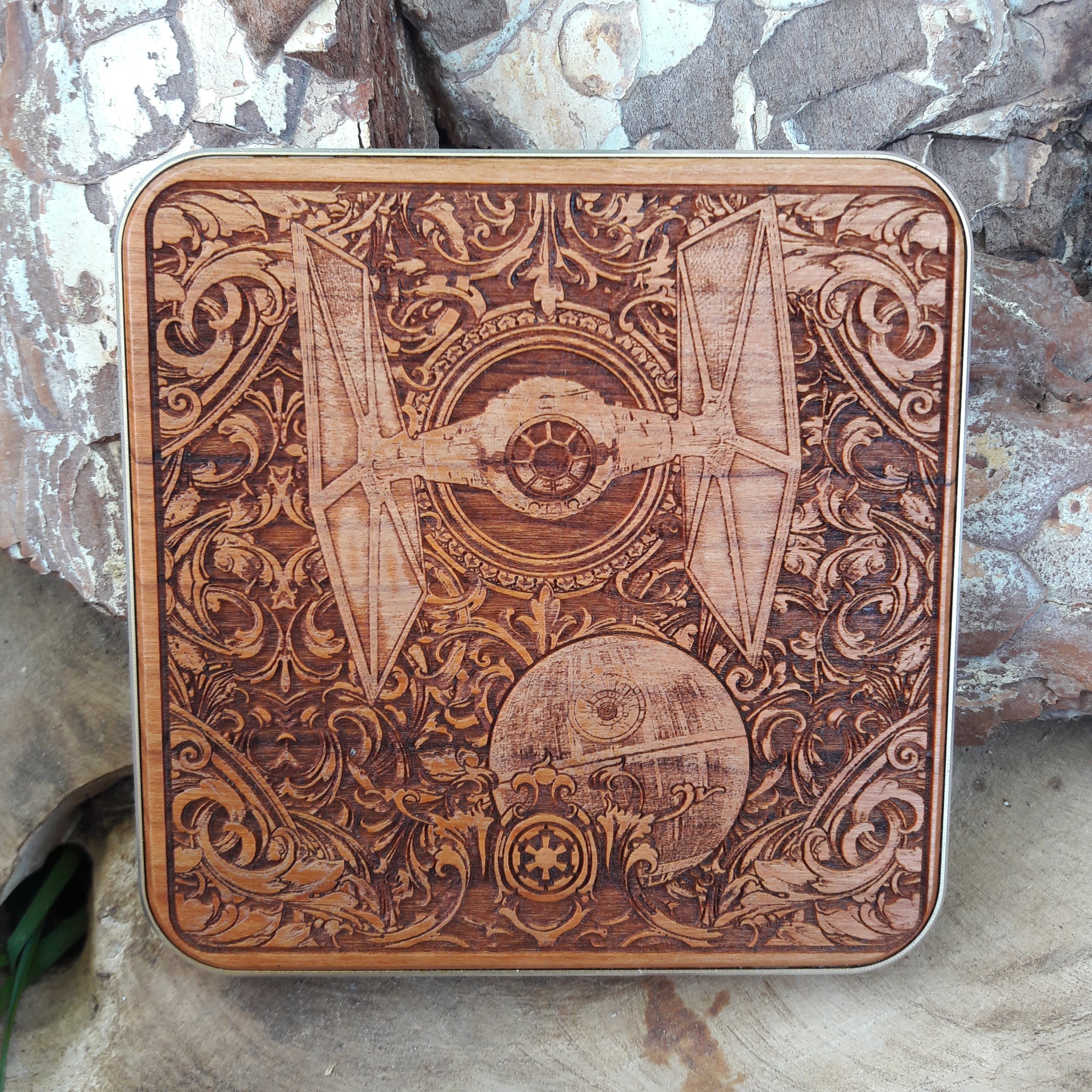 Close-up of Star Wars-inspired ship engraving on wood wireless charger.