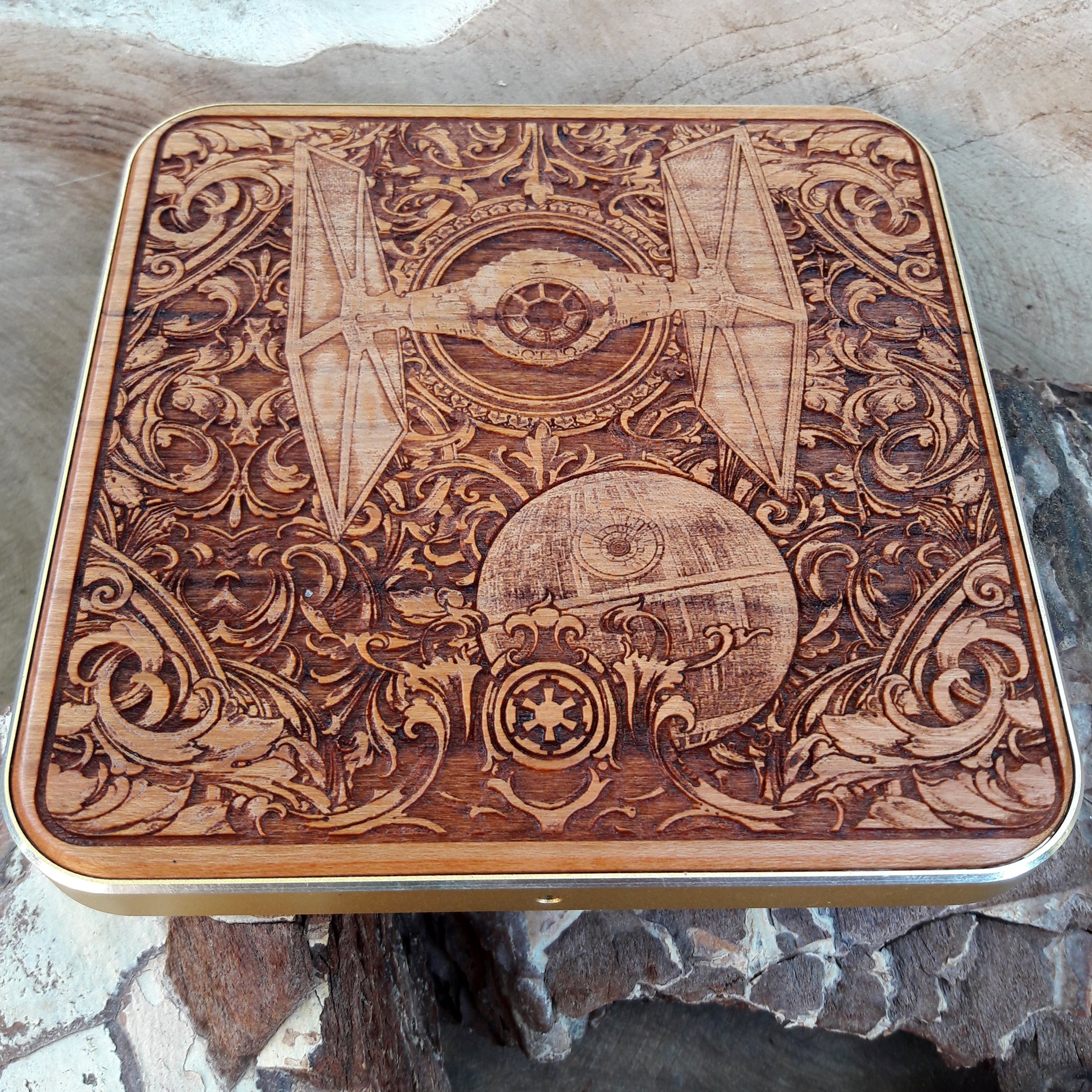 Side angle of galaxy fleet carved into wooden wireless charger.