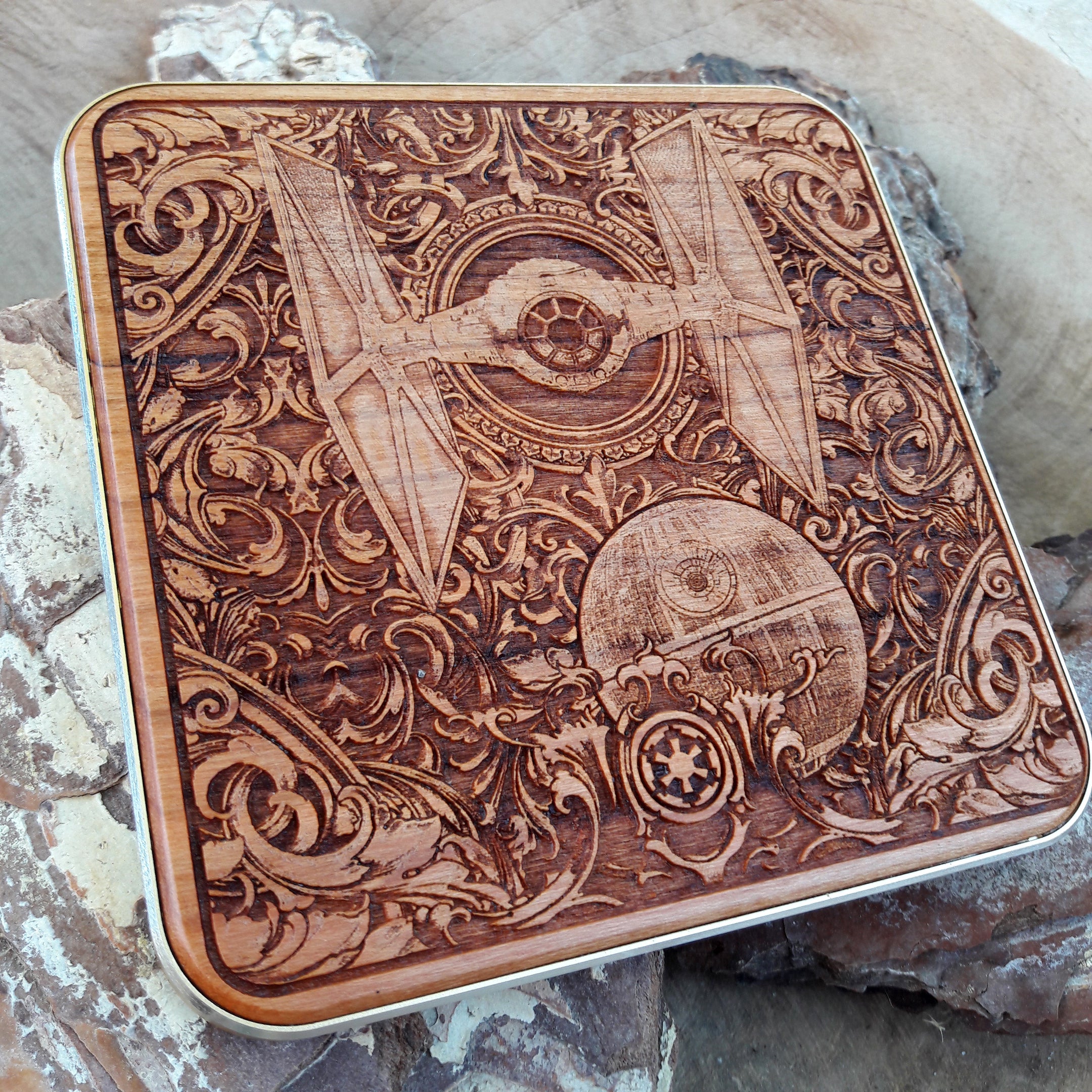 Top view of epic space battle scene on engraved wood charger.
