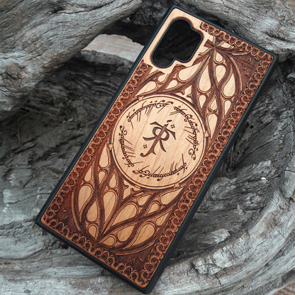 Tolkien-inspired wood phone case featuring the J.R.R. Tolkien monogram, Elvish script, and intricate designs. Laser-engraved for a unique and detailed look, this durable case is compatible with iPhone 16, 15, 14, 13, 12, 11, Pro Max, Mini, and Samsung Galaxy S25, S24, S23, S22, S21, S20 Ultra, Plus, Note 20. A perfect protective accessory for Lord of the Rings fans.