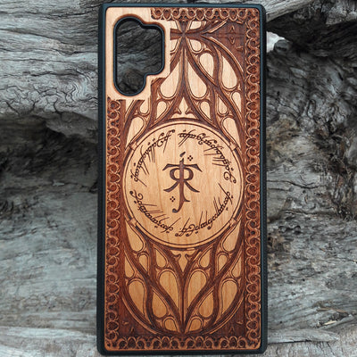 Tolkien-inspired wood phone case featuring the J.R.R. Tolkien monogram, Elvish script, and intricate designs. Laser-engraved for a unique and detailed look, this durable case is compatible with iPhone , 15, 14, 13, 12, 11, Pro Max, Mini, and Samsung Galaxy S, S24, S23, S22, S21, S20 Ultra, Plus, Note 20. A perfect protective accessory for Lord of the Rings fans.