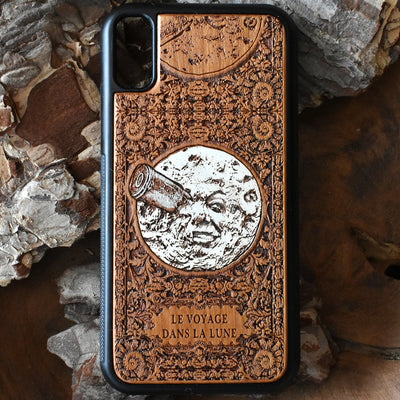 Laser-engraved "A Trip to the Moon" design on a wooden phone case, compatible with iPhone 16, iPhone 15, Galaxy S25, Note 20, and more.