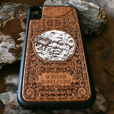 Laser-engraved "A Trip to the Moon" design on a wooden phone case, compatible with iPhone 16, iPhone 15, Galaxy S25, Note 20, and more.