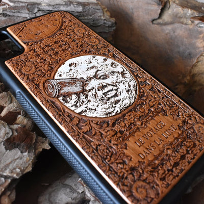 Laser-engraved "A Trip to the Moon" design on a wooden phone case, compatible with iPhone 16, iPhone 15, Galaxy S25, Note 20, and more.