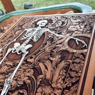 Halloween-inspired gothic skeleton lovers wood carving