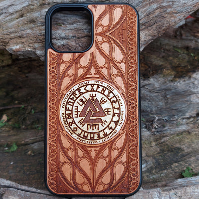 Nordic-inspired wooden phone case featuring a Valknut symbol surrounded by runic designs, precision-engraved for a bold and meaningful statement. This protective case is a perfect fit for iPhone , 15, 14, 13, 12, 11, Pro Max, Mini, and Samsung Galaxy S, S24, S23, S22, S21, S20 Ultra, Plus, Note 20. Ideal for those who admire Norse mythology and elegant craftsmanship.