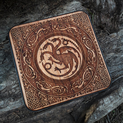 Overhead view of Game of Thrones-inspired art on wooden charger.