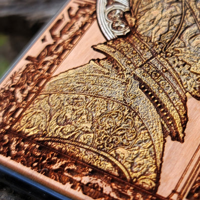 Hand-finished cherry wood phone case with detailed laser engraving, perfect for iPhone & Samsung Galaxy users.