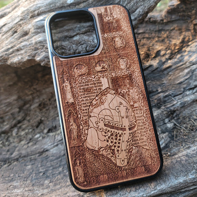 Intricately carved wooden phone case featuring a medieval knight helmet and gothic designs. Handcrafted for iPhone  and Galaxy S users, perfect for fans of history and medieval art.