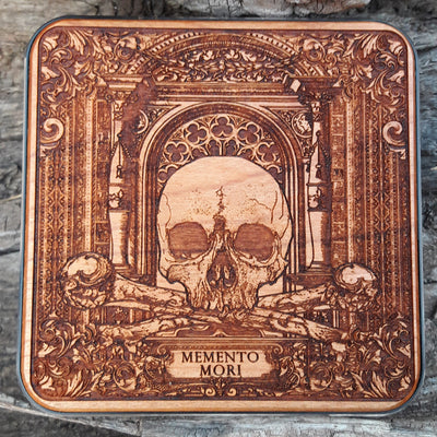 Hand-painted wireless charger with memento mori skull design.