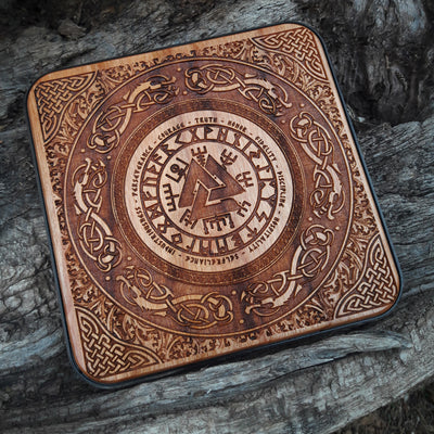 Norse symbols and runes painted on Viking-themed wireless charger.